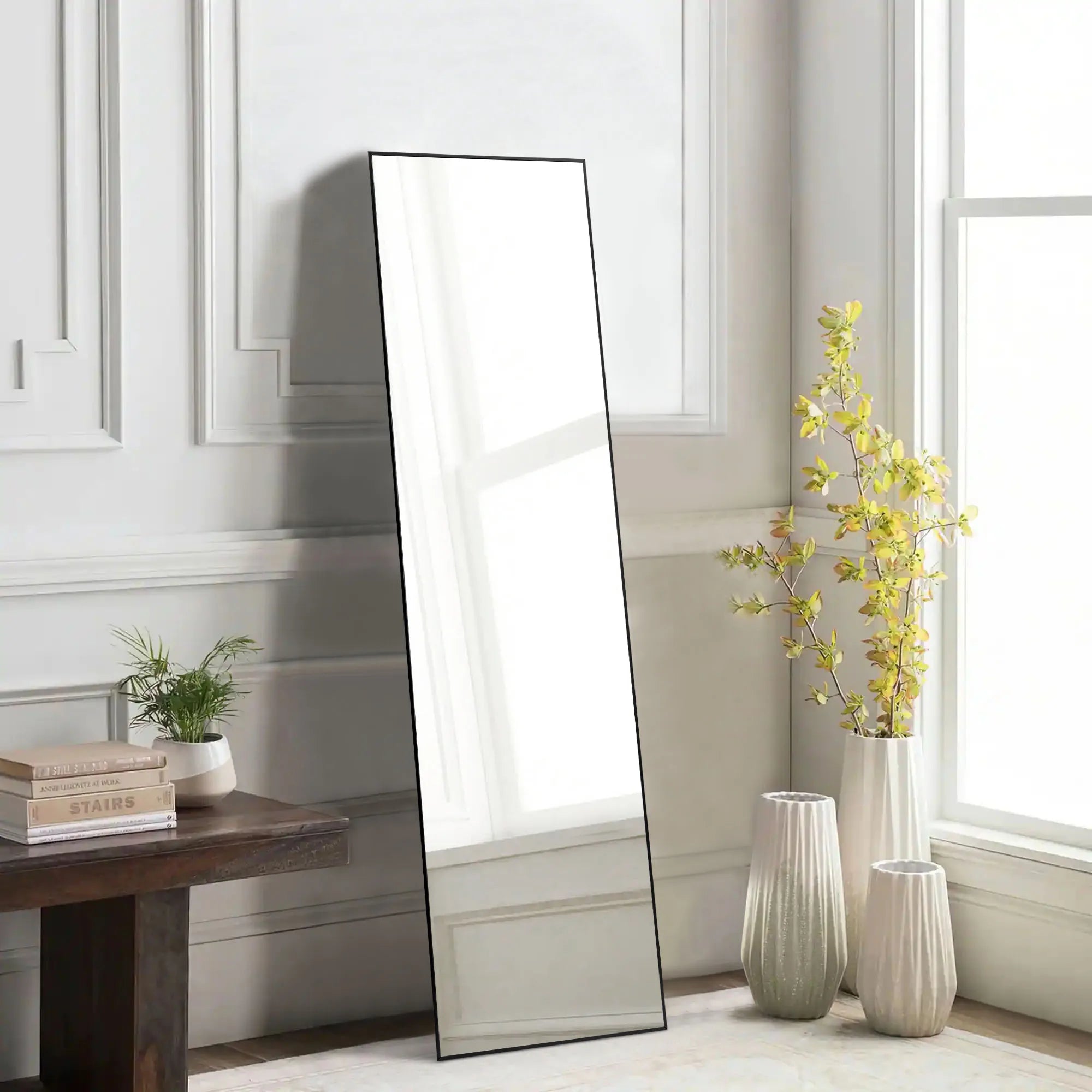 Close-up of the ultra-thin black aluminum frame on the square top standing mirror.